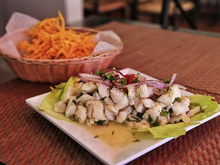 ¡Visita el nuevo local! $25 por 2 Platos principales, a escoger entre Ceviche de pescado, Escabeche de pescado o Biftec encebollado + 1 Acompañante por plato, a elegir entre tostones, arañitas, arroz en base de cilantro o majado de viandas + 2 Sopas de calabaza o de brócoli y queso + 2 Sangrías de la casa